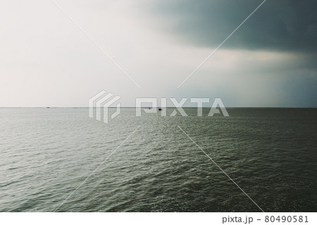 Small hut in the middle of the sea under coming storm. Small hut in the middle of the sea under coming storm. 80490581
