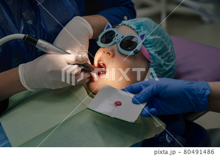 oral hygiene and treatment of the child. teeth cleaning at stomatologist oral hygiene and treatment of the child. teeth cleaning at stomatologist 80491486