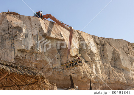 The process of quarrying stone from rocks in Egypt. The process of quarrying stone from rocks in Egypt. 80491842