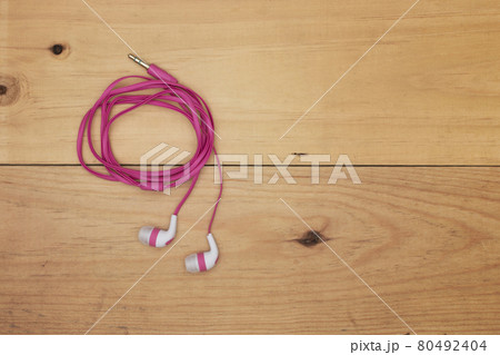 earphones on the wooden board 80492404