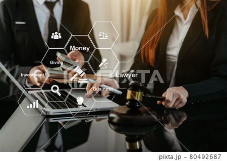 Businessman giving bribe money in the envelope to partner in a corruption scam. 80492687