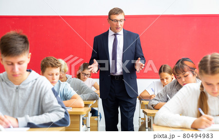 Teenage students working at class during lesson Teenage students working at class during lesson 80494983