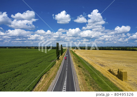 Grey asphalted narrow country road aerial view 80495326