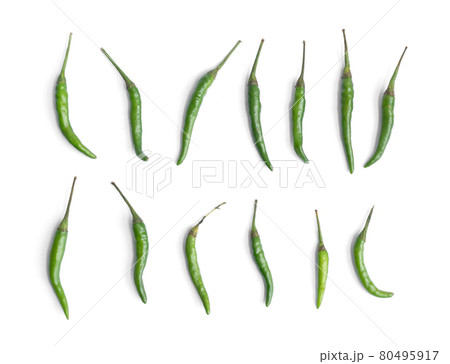 Chili peppers with sliced green chili peppers isolated on white background. Hot and spicy food. Vegetable. Seasoning ingredient. Chili peppers with sliced green chili peppers isolated on white background. Hot and spicy food. Vegetable. Seasoning ingredient. 80495917