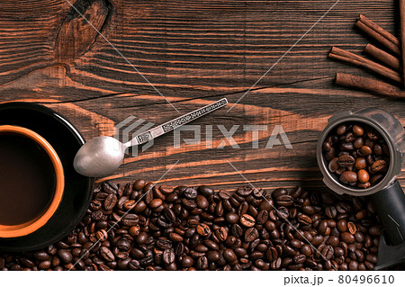 Coffee cup and beans frame on wooden table 80496610