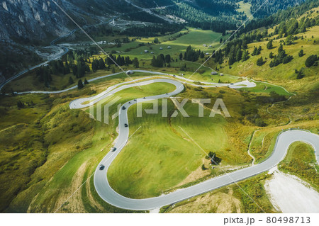 Aerial view of serpentine roud of passo Gardena and Sella group mountains in Dolomites, South Tyrol, Italy, Europe 80498713