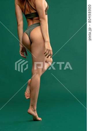 Back view of perfect slim body. Full length portrait. Young woman with her natural healthy skin. Back view of perfect slim body. Full length portrait. Young woman with her natural healthy skin. 80498900