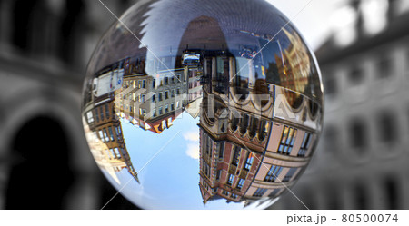 Town houses in the old town of Hanover, Germany, upside down through a glass ball Town houses in the old town of Hanover, Germany, upside down through a glass ball 80500074