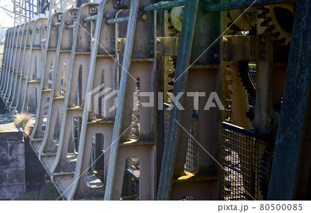 Cast iron gray supports for the gears on a historic weir on the river Aller in Germany Cast iron gray supports for the gears on a historic weir on the river Aller in Germany 80500085