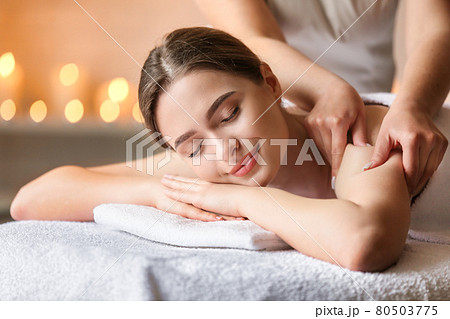 Beautiful woman relaxing and having massage in a SPA. 80503775