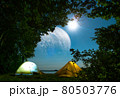 Camp in the forest at night, with a beautiful view of space and the moon 80503776