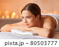 Beautiful woman with honey eyes, in towel relaxing. 80503777