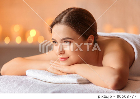 Beautiful woman with honey eyes, in towel relaxing. Beautiful woman with honey eyes, in towel relaxing. 80503777