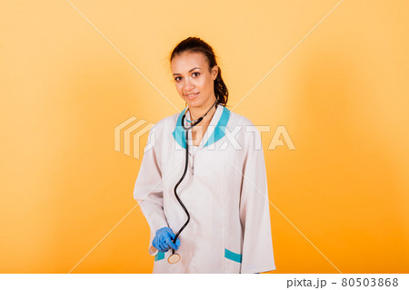 Healthcare and medical concept - african doctor holding syringe with injection, stethoscope 80503868