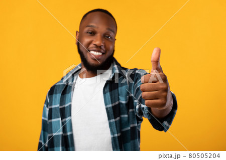 Positive African American Guy Gesturing Thumbs Up, Studio Shot 80505204