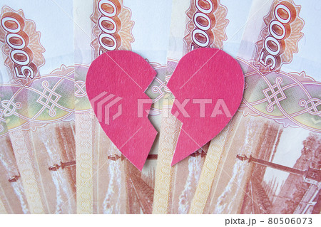 Valentine heart broken in two on roubles banknotes. . Valentine heart broken in two on roubles banknotes. . 80506073