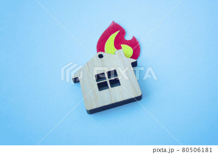 Fire house, insurance and mortgage concept. Small wooden house 80506181