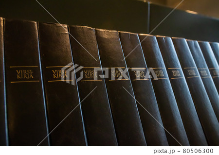 Porvoo, Finland - 2 October 2019: Closeup of a row of green hymn books on finnish language in Porvoo Cathedral. 80506300