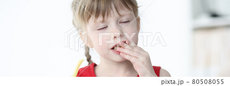 Little girl with closed eyes eating delicious fries 80508055