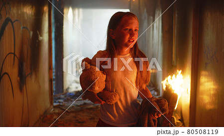 Fireman carrying kid heroically through smoke and fire Fireman carrying kid heroically through smoke and fire 80508119