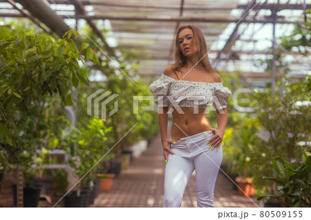 Smiling beauty in garden looking at camera. Smiling beauty in garden looking at camera. 80509155
