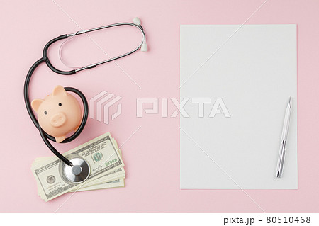 Piggy bank with stethoscope. Paid medicine concept 80510468