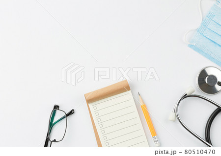 Notebook with stethoscope and mask. 80510470