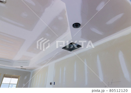 Finishing putty on drywall with a spatula wall Finishing putty on drywall with a spatula wall 80512120