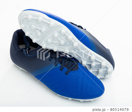 Football boots with studs isolated on white background Football boots with studs isolated on white background 80514079