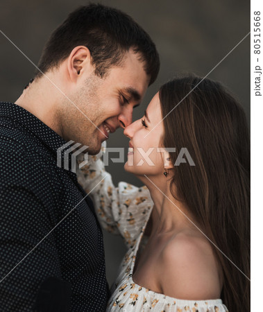 Close up sensual portrait of young couple in love, together, happy, looking at each other Close up sensual portrait of young couple in love, together, happy, looking at each other 80515668