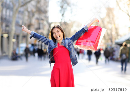 Shopping woman excited on La Rambla in Barcelona Shopping woman excited on La Rambla in Barcelona 80517619