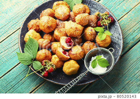Cottage cheese donuts with raspberries 80520143