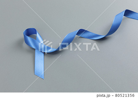 Blue ribbon on gray background 80521356