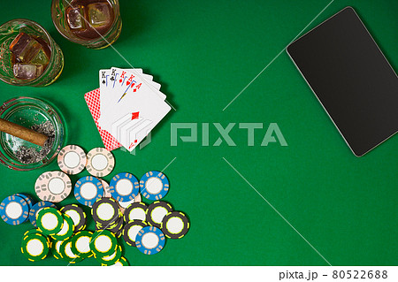 Set to playing poker with cards and chips on green table, top view Set to playing poker with cards and chips on green table, top view 80522688