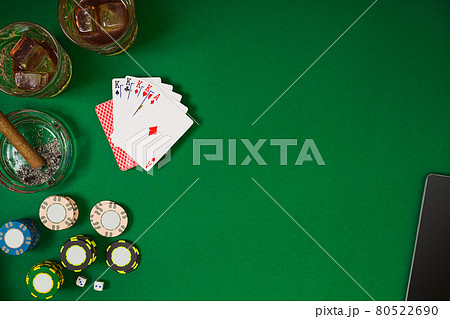Set to playing poker with cards and chips on green table, top view Set to playing poker with cards and chips on green table, top view 80522690