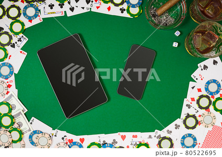 View from above with copy space. Banner template layout mockup for online casino. Green table, top view on workplace. View from above with copy space. Banner template layout mockup for online casino. Green table, top view on workplace. 80522695