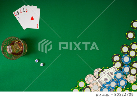 Set to playing poker with cards and chips on green table, top view 80522709