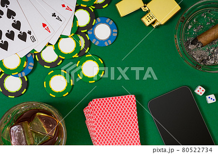 Set to playing poker with cards and chips on green table, top view Set to playing poker with cards and chips on green table, top view 80522734