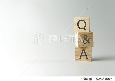 Q and A alphabet on wooden cube in hand hold with background. Question and answer meaning. Q and A alphabet on wooden cube in hand hold with background. Question and answer meaning. 80523667