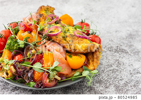 Omelette with stewed vegetables and salmon Omelette with stewed vegetables and salmon 80524985