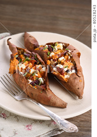 Baked stuffed sweet potato Baked stuffed sweet potato 80528243