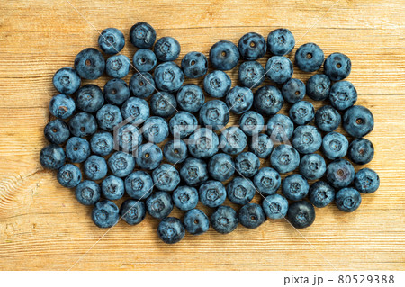 Blueberries ripe on wooden table background. Harvesting concept. Top view 80529388