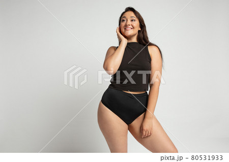 Young beautiful plump woman in cotton underwear on white background Young beautiful plump woman in cotton underwear on white background 80531933