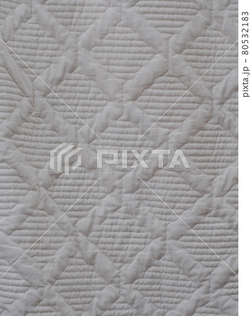 white soft cotton summer abstract patchwork pattern blanket hanging after wash in laundry. 80532183