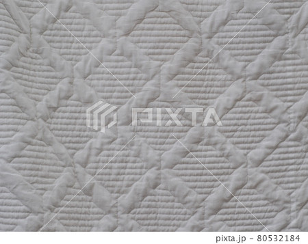 white soft cotton summer abstract patchwork pattern blanket hanging after wash in laundry. 80532184
