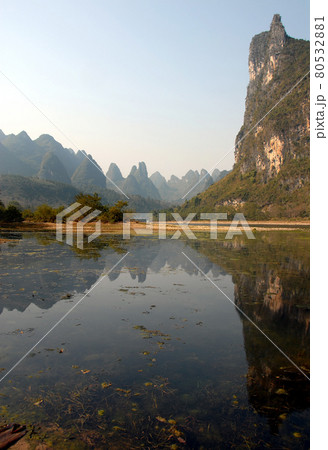 Reflections on the Li River between Guilin and Yangshuo in Guangxi Province, China. The karst hills and river scenery have provided inspiration for artists and poets. Li River scenery, Guilin. 80532881