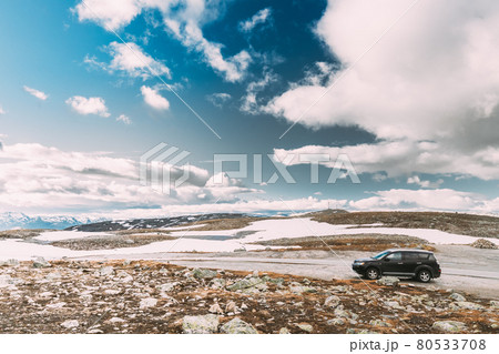 Aurlandsfjellet, Norway. Car SUV Parked Near Aurlandsfjellet Scenic Route Road In Summer Norwegian Landscape. Natural Norwegian Landmark And Popular Destination 80533708