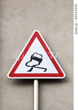 Slippery when wet road sign Slippery when wet road sign 80534291
