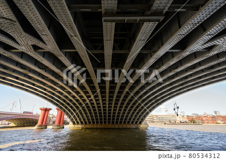 Beneath Blackfriars Railway Bridge in London, UK. The steel beams hold the structure in place with the Blackfriars station above. Also Blackfriars Road Bridge, St Pauls Cathedral and River Thames. Beneath Blackfriars Railway Bridge in London, UK. The steel beams hold the structure in place with the Blackfriars station above. Also Blackfriars Road Bridge, St Pauls Cathedral and River Thames. 80534312