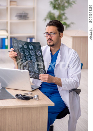 Young male doctor radiologist working in the clinic 80534886